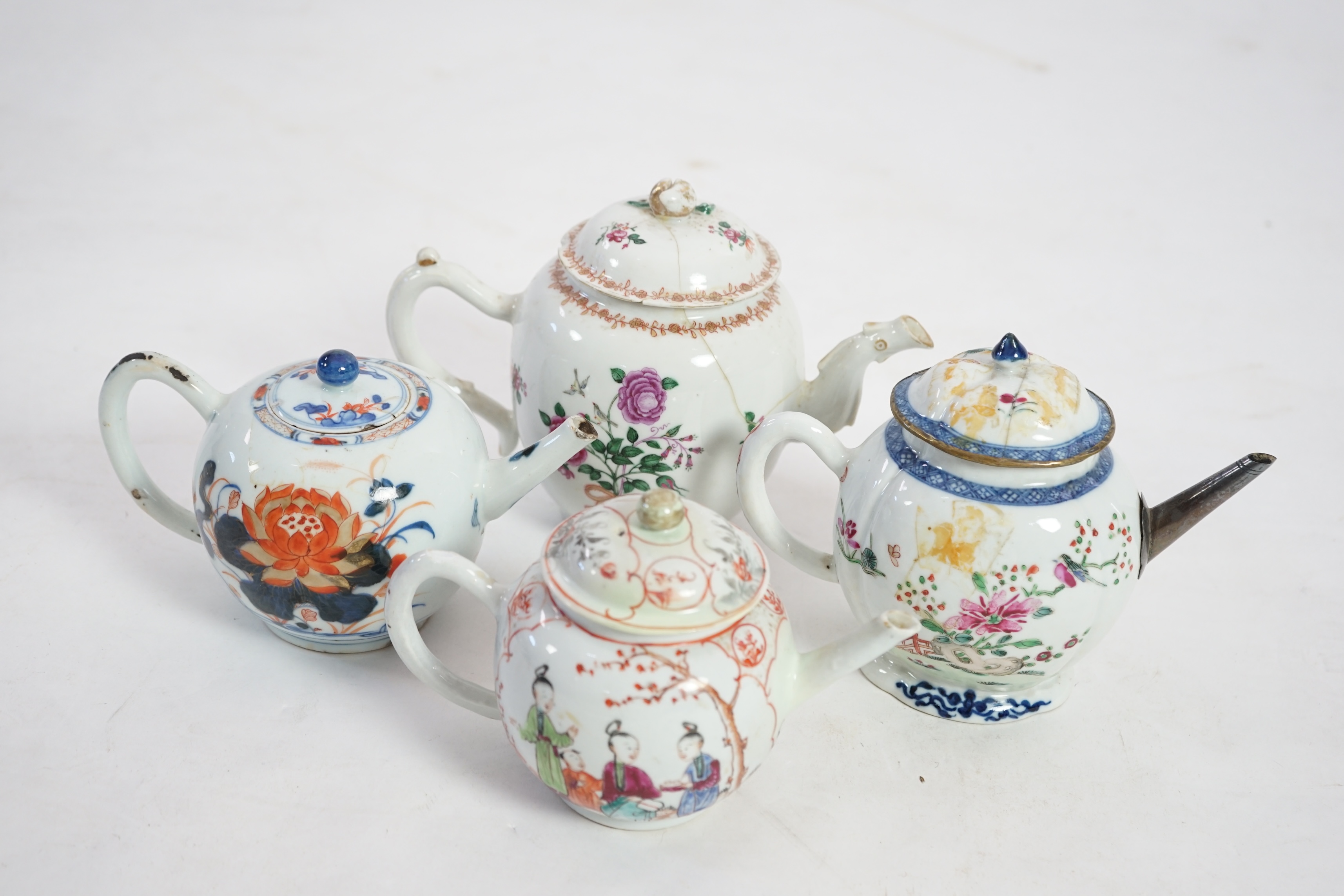 Four 18th century Chinese export polychrome decorated teapots and covers